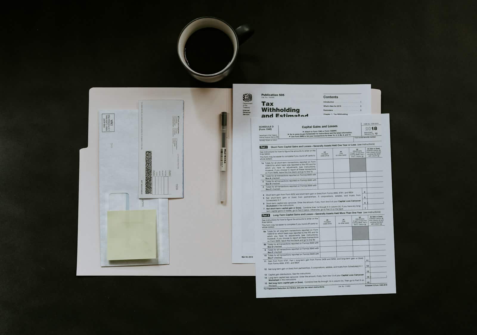 Tax forms and coffee on a desk - BizBud pricing