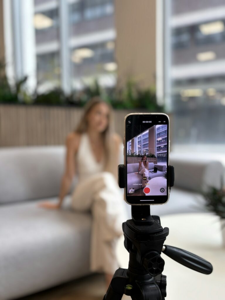 TikTok creator filming with phone on a tripod